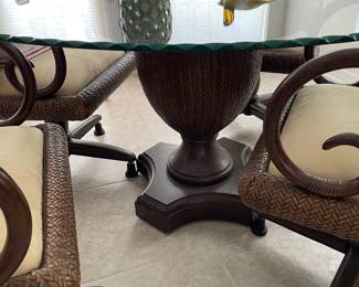 $400 Decorative, rattan dinning table.   Comes with casters for chairs, but the casters are not currently shown - note, scalloped edge on glass top