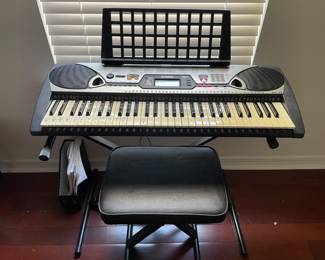 $75.00. Yamaha keyboard with stand and seat EZ-20