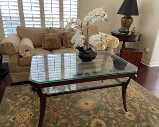 $250 heavy, 2 tier glass and wrought iron coffee table