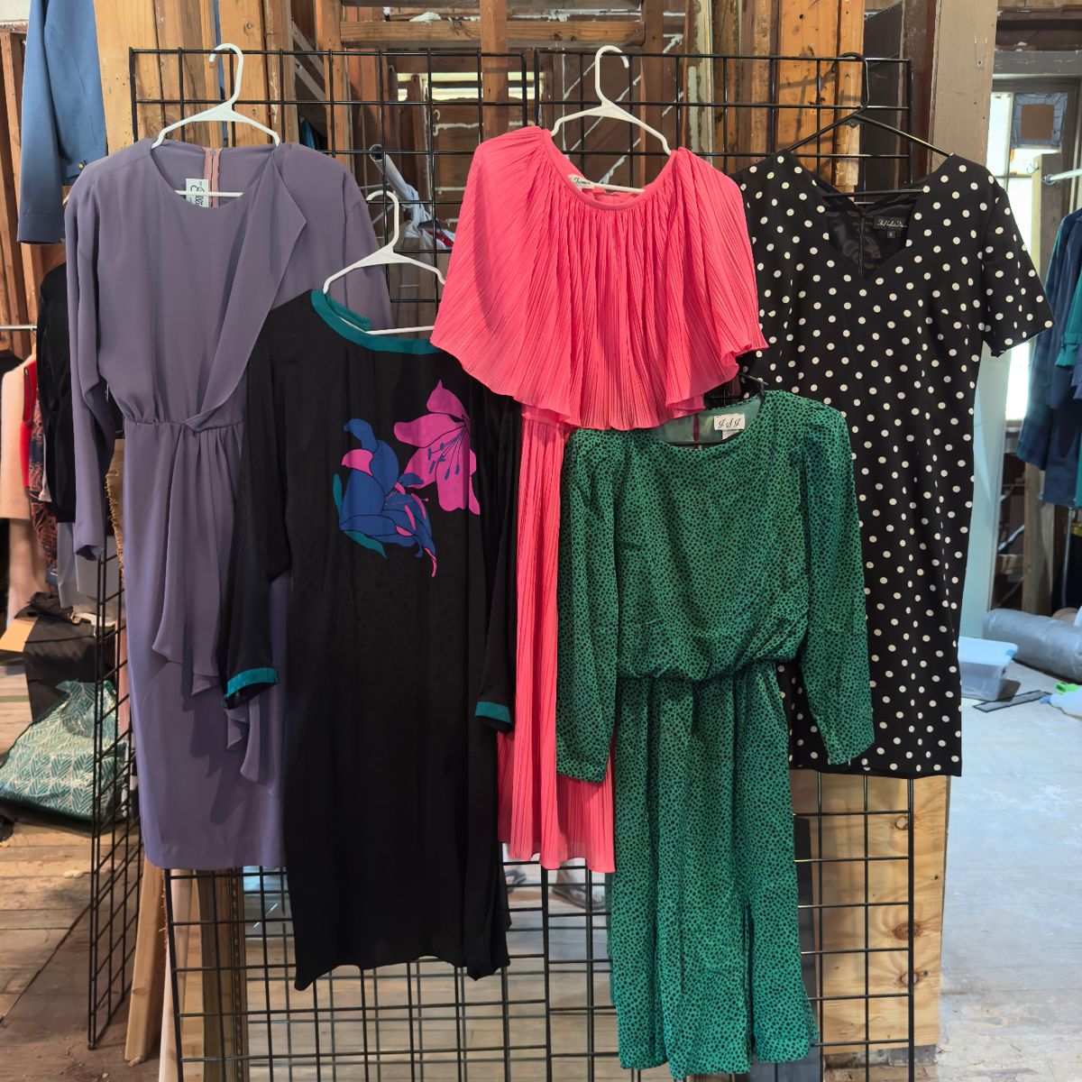 1980s vintage dresses in playful prints, bold colors, and dramatic silhouettes— polka dots, pleats, graphic florals…