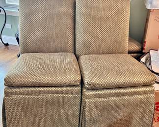 2 of 6 matching Sage green chairs