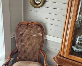 Vintage French Provincial captains chair included in dining set. Vintage plate paintings.