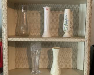 Wicker bathroom shelf. Assorted bud vases.