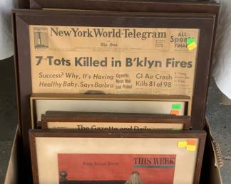 Framed last front pages of newspapers that have folded.
