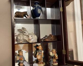 small curio cabinet & hummels
