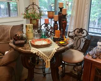 Marble top table w 2 swival bar stool chairs.