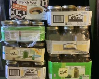 Assorted Sizes of Canning Jars with Some Rings