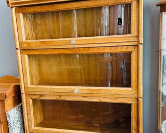 There are two sets of lawyer bookcases