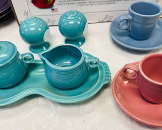 Fiesta creamer and sugar and cups and saucers