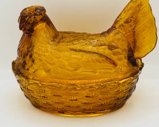 Amber glass hen on nest