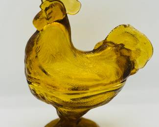 Amber rooster on nest