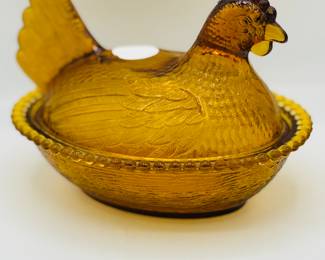 Amber glass hen on nest