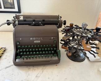 Vintage Royal typewriter and antique rotating stamp holder