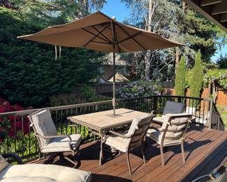 Patio table and chair set. Tiled table top, powder coating on aluminum frame, 2 swivel rockers, 2 guest chairs, cushions and (40 x 64): $380.00 Umbrella sold separately: $290.00