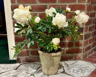 One of several faux peony planters