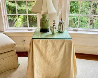 Square skirted table with glass top