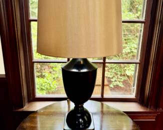 Pair of black metal urn shaped lamps