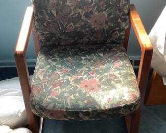 Floral print covered chair with wood arms and frame