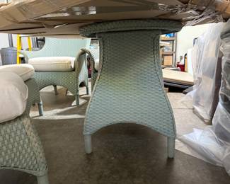 Lloyd Flanders patio set; 4 chairs, round table with glass top, and oval side table with glass top