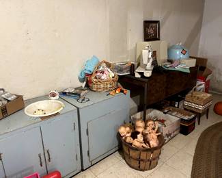 basket of dolls, home made stove and sink (wood), sewing supplies