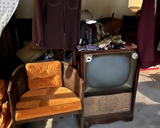 old tv and chair in basement