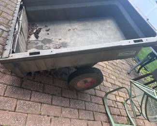Rubbermaid Pull Behind Garden Cart $125.00 measures 48x35