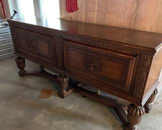 Vintage Lion adorned wood sideboard with locking doors