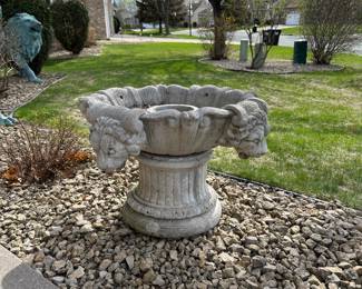 Lion adorned bird bath fountain