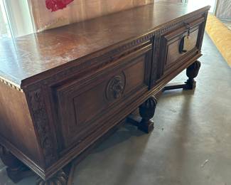 Vintage Lion adorned wood sideboard with locking doors