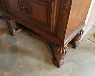 Vintage Lion adorned wood sideboard with locking doors