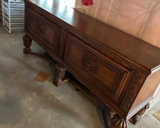 Vintage Lion adorned wood sideboard with locking doors