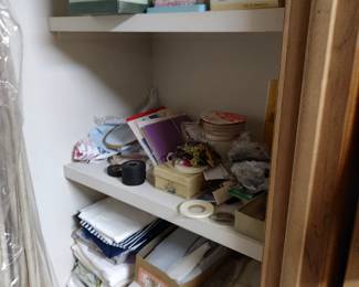 A lot of sewing supplies, patterns, buttons, material