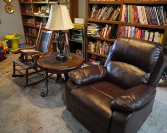 recliner, lamp, round table, rocker, books, bookcases