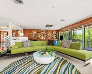 Living room: wrap-around sectional sofa, houseplants