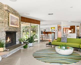 Living room: wrap-around sectional sofa, houseplants