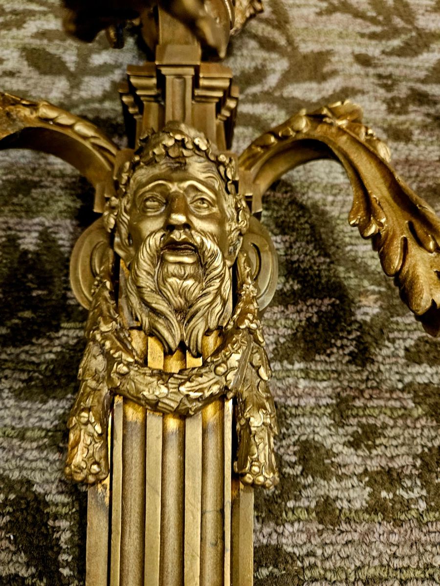 Close up of faces on the 2 candleabras