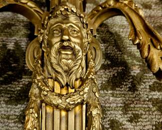Close up of faces on the 2 candleabras