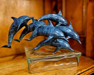 Tabletop size sculpture, signed "Pod of Dolphins"