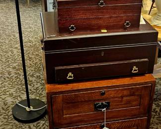 Wooden silverware boxes and a wooden filing cabinet