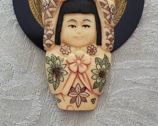 Carved asian brooch
