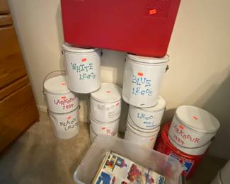 Legos sorted by color in tins