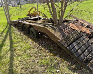 . . . car hauler as found! Buyer cuts tree out to salvage this beauty!