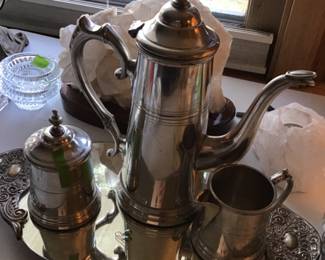 Pewter coffee set with mirror tray.