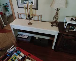 White organ bench, space for music underneath.