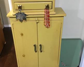 Small yellow cupboard, jewelry box on top sold separately.