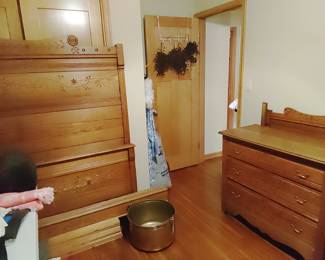 East Lake spoon carved 3 drawer dresser with mirror, and a full size bed with a tall headboard.