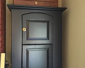 3-door, narrow blue cupboard. 3 small chests on top sold separately.