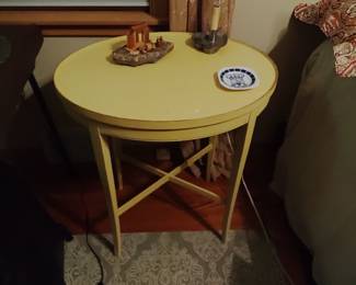 Small, yellow, oval table.