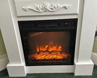 #74 - $70 - Plug in fireplace - heater 32wx9dx30t