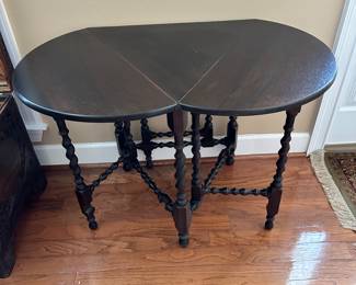#41 - $250 - Unusual barley twist table with rounded sides 39wx25dx29t